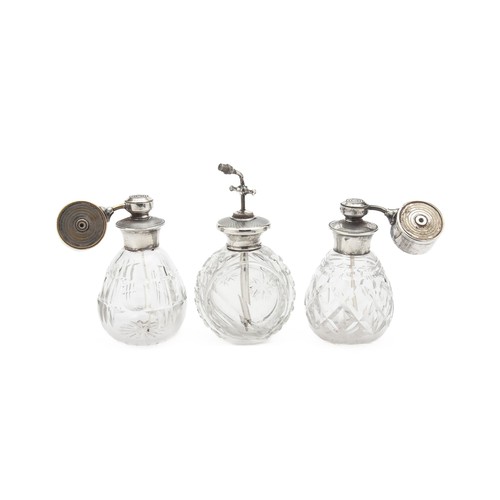 1022 - A TRIO OF SILVER- MOUNTED GLASS PERFUME BOTTLES, LONDON, 20TH CENTURY