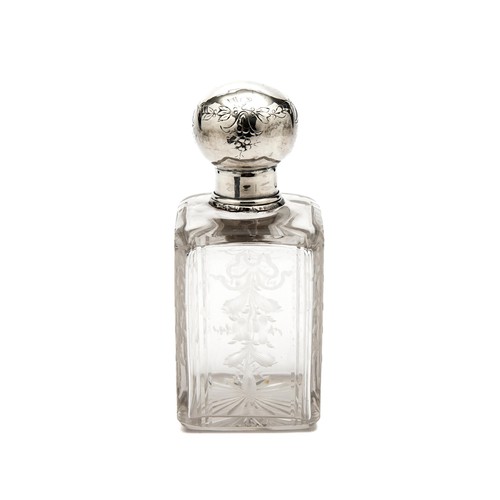 1025 - A SILVER TOPPED GLASS DRESSING TABLE BOTTLE