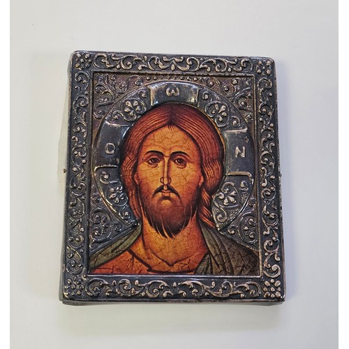 83 - A SILVER FRAMED RELIGIOUS ICON