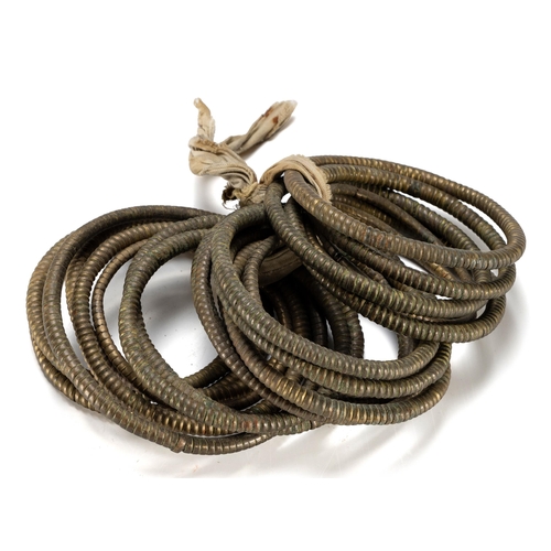 290 - TWENTY ZULU BRASS ANKLETS