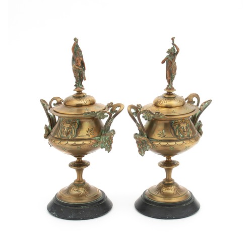 742 - A PAIR OF COMPOSITE MOULDED BRASS PAINTED TROPHY CUPS WITH COVERS