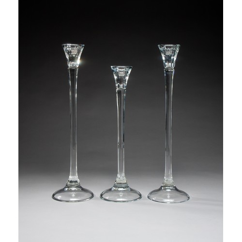 683 - THREE TALL GLASS CANDLE HOLDERS