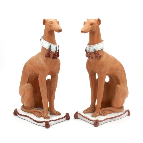 736 - A PAIR OF CERAMIC SEATED HOUNDS