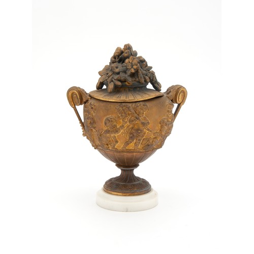 722 - A GILT-BRONZE PAINTED COMPOSITE URN WITH COVER