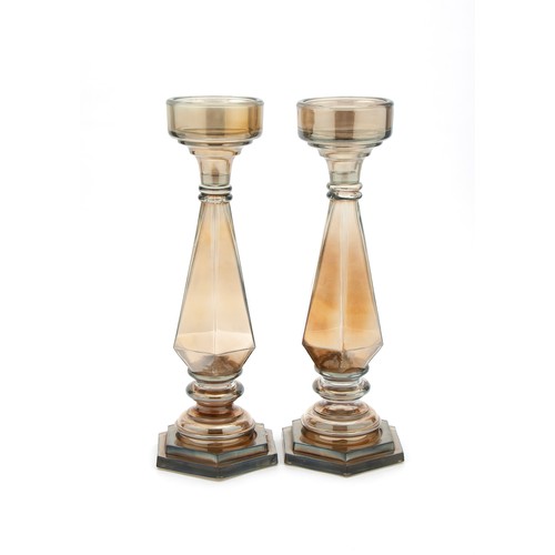 670 - A LARGE PAIR OF GLASS CANDLE HOLDERS