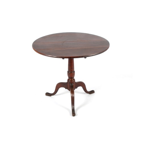 372 - AN OAK TILT-TOP OCCASIONAL TABLE