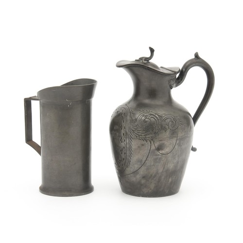 32 - A PEWTER WATER AND MILK JUG