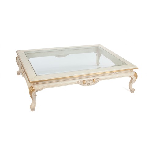 286 - A GLASS-TOPPED WHITE-PAINTED AND GILT RECTANGULAR COFFEE TABLE