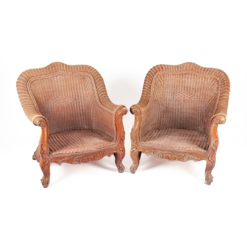 357 - A PAIR OF CANE VERANDA ARMCHAIRS