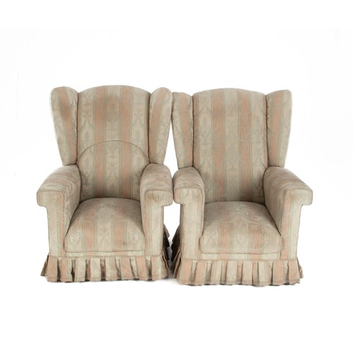 284 - A PAIR OF UPHOLSTERED WINGBACK ARMCHAIRS