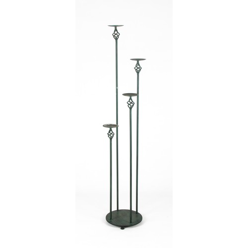 672 - A WROUGHT-IRON CANDLE STAND