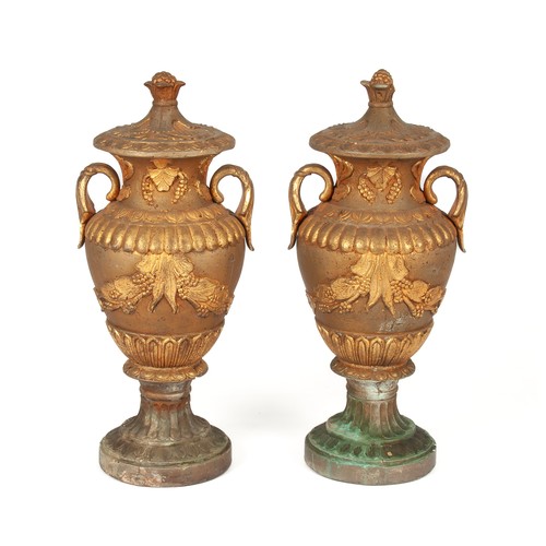 723 - A PAIR OF STONE DECORATIVE URNS