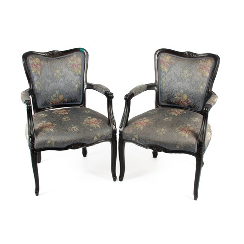 60 - A PAIR OF EBONISED UPHOLSTERED OPEN ARMCHAIRS, 20TH CENTURY