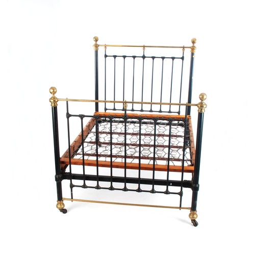 49 - A BLACK-PAINTED WROUGHT-IRON AND BRASS BED STAND