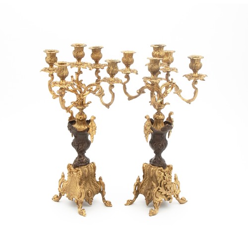 637 - A PAIR OF BRASS FIVE-LIGHT CANDELABRUM