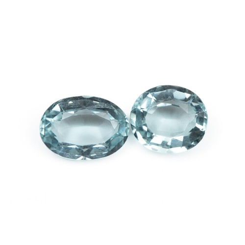 1275 - A PAIR OF UNSET LIGHT BLUE TOPAZ, 5.4 CARATS