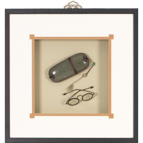 89 - A FRAMED SET OF LENSED GLASSES