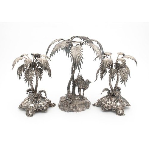 747 - AN ELECTROPLATE TABLE CENTREPIECE AND A PAIR ASSOCIATED ELECTROPLATE PALM TREE CENTREPIECES