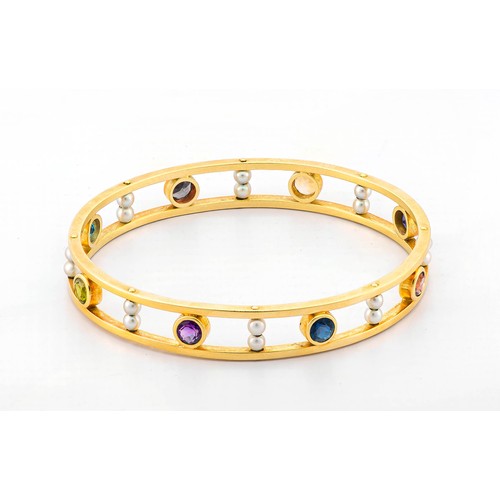 683 - A GOLD, SEED PEARL AND GEMSTONE BANGLE