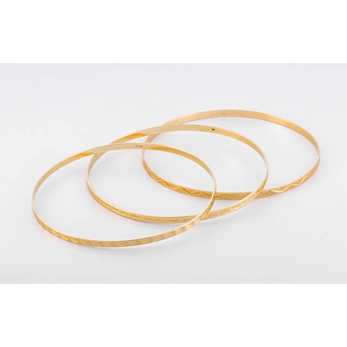 703 - THREE GOLD BANGLES