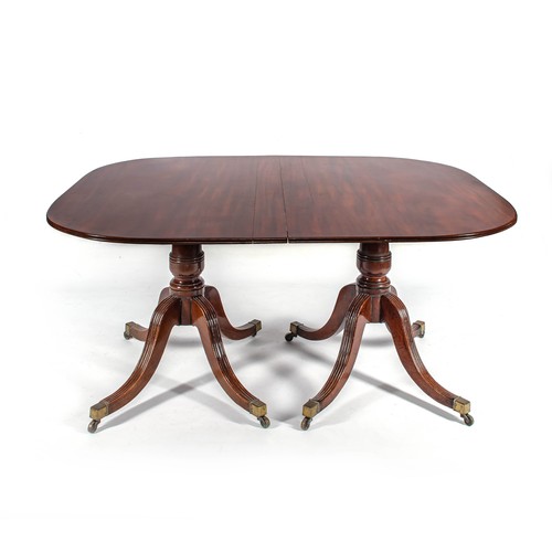 152 - A REGENCY MAHOGANY EXTENDING DINING TABLE