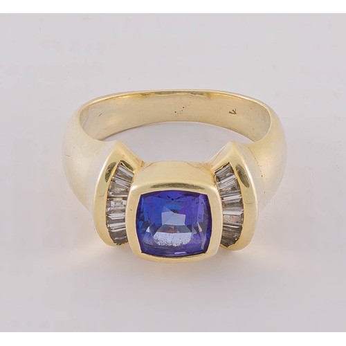 723 - A DIAMOND AND TANZANITE RING