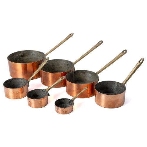 932 - A SET OF SEVEN COPPER SAUCEPANS