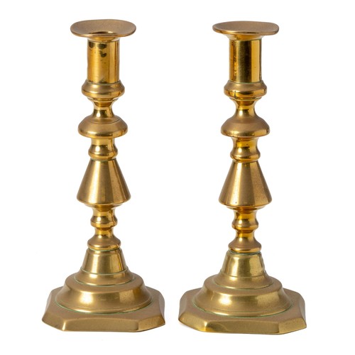 952 - A PAIR OF BRASS CANDLESTICKS