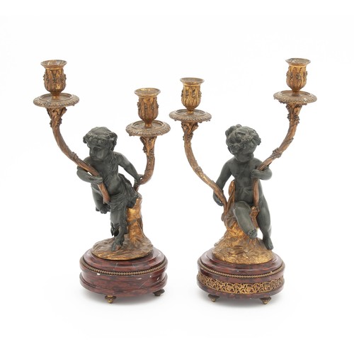 902 - A SPELTER AND MARBLE CLOCK GARNITURE