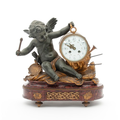 902 - A SPELTER AND MARBLE CLOCK GARNITURE