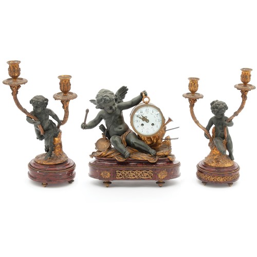 902 - A SPELTER AND MARBLE CLOCK GARNITURE