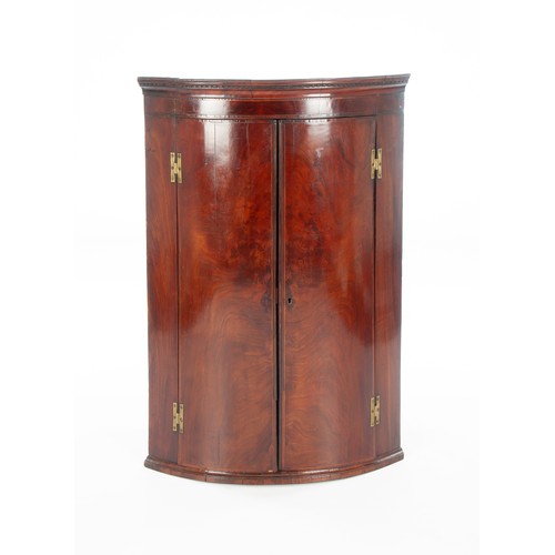 471 - A GEORGE-III MAHOGANY HANGING CORNER CABINET