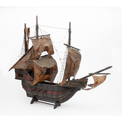 173 - A WOODEN MODEL SAILING SHIP