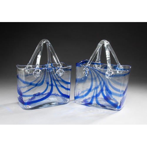 312 - A PAIR OF CLEAR AND BLUE GLASS VASES IN THE SHAPE OF A BASKET WITH HANDLES