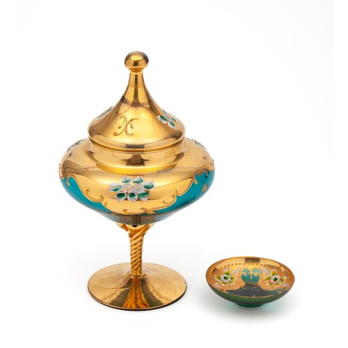 228 - A GREEN VENETIAN GLASS LIDDED PEDESTAL JAR AND TRINKET DISH WITH GILT OVERLAY AND FLORAL DESIGN