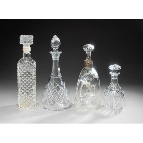 233 - A GROUP OF FOUR GLASS DECANTERS AND STOPPERS IN SIZES