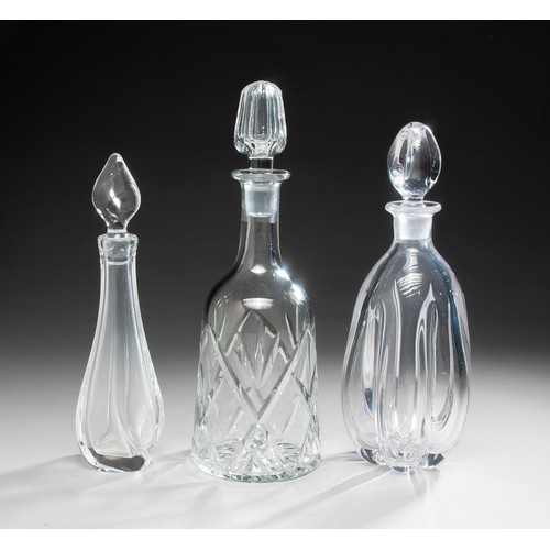 234 - A GROUP OF THREE CUT GLASS DECANTERS AND STOPPERS