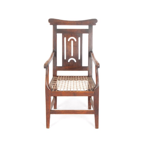 483 - A SOUTH AFRICAN TEAK ARMCHAIR