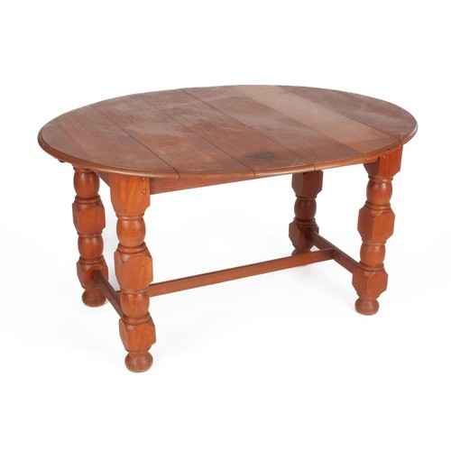 520 - A FRUITWOOD EXTENDING DINING TABLE