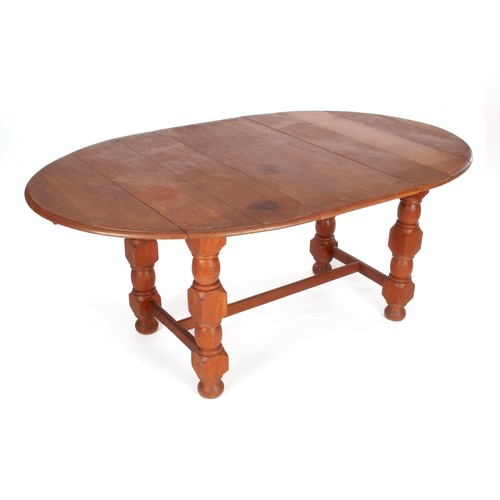 520 - A FRUITWOOD EXTENDING DINING TABLE