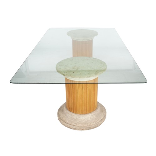 575 - A GLASS-TOPPED DINING TABLE