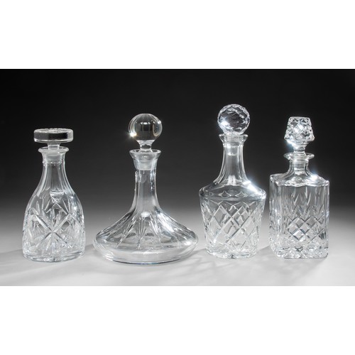 236 - A GROUP OF FOUR GLASS DECANTERS AND STOPPERS, INCLUDING A SHIPS DECANTER