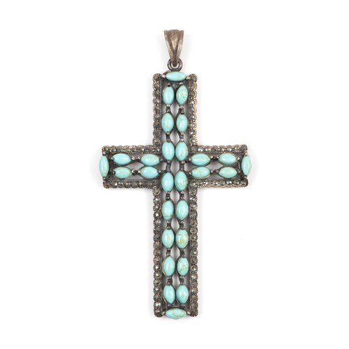 928 - A SILVER AND TURQUOISE CROSS