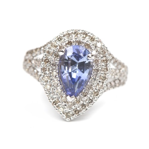 973 - A TANZANITE AND DIAMOND DRESS RING