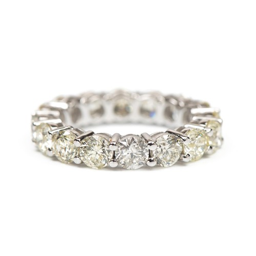 980 - A NATURAL DIAMOND FULL ETERNITY RING, 5.08 CARATS