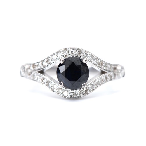 972 - A SAPPHIRE AND NATURAL DIAMOND RING