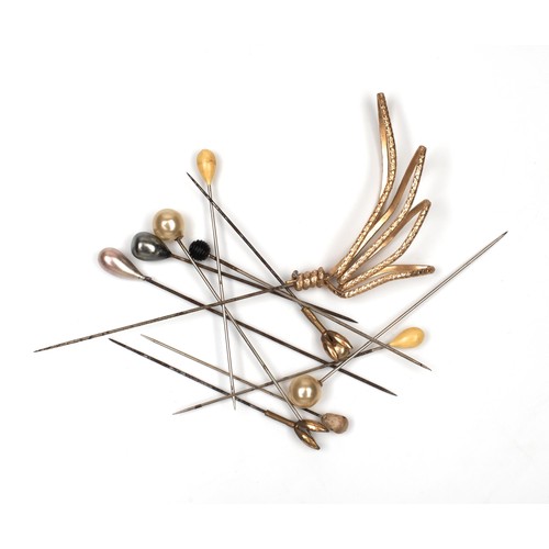 884 - A COLLECTION OF HAT PINS