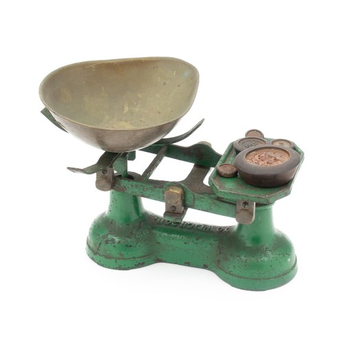 148 - A GREEN-PAINTED CAST-IRON KITCHEN SCALE