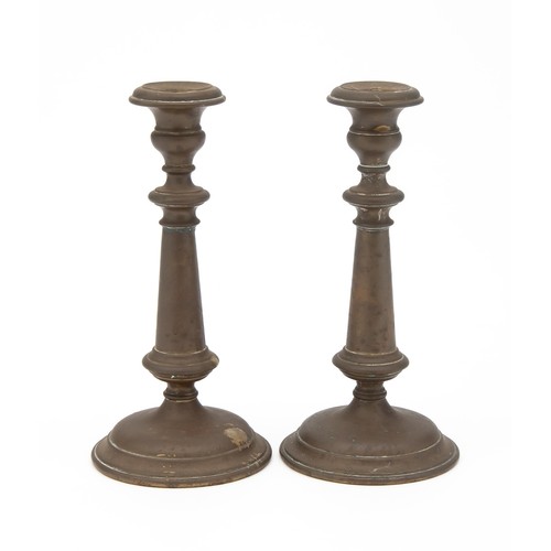 105 - A PAIR OF BRASS CANDLESTICKS