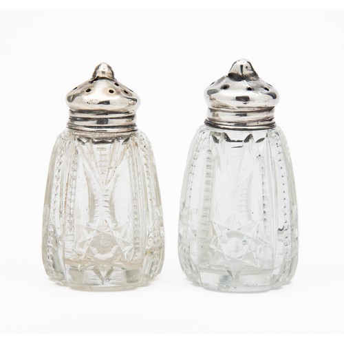 722 - A PAIR OF SILVER TOPPED SALT AND PEPPER SHAKERS, LONDON, MAKERS MARK AND DATE RUBBED